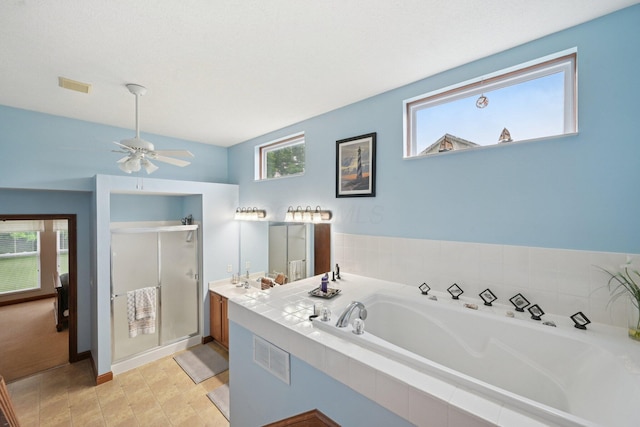 13946 Bainwick Dr NW, Pickerington, OH 43147 - bathroom with a shower stall, a garden tub, a ceiling fan, and double vanity