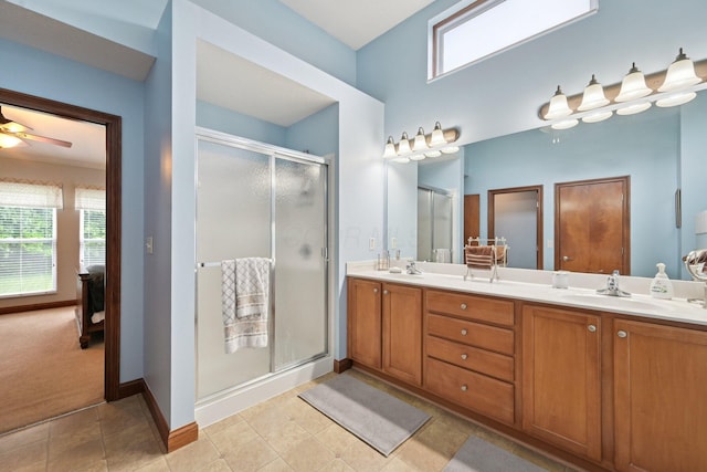 13946 Bainwick Dr NW, Pickerington, OH 43147 - bathroom featuring double vanity, a stall shower, and a ceiling fan