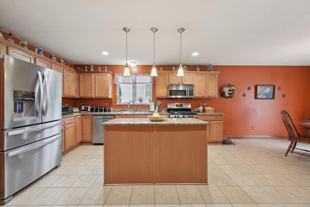 13946 Bainwick Dr NW, Pickerington, OH 43147 - kitchen featuring appliances with stainless steel finishes, a kitchen island, recessed lighting, light tile patterned floors, and light stone countertops