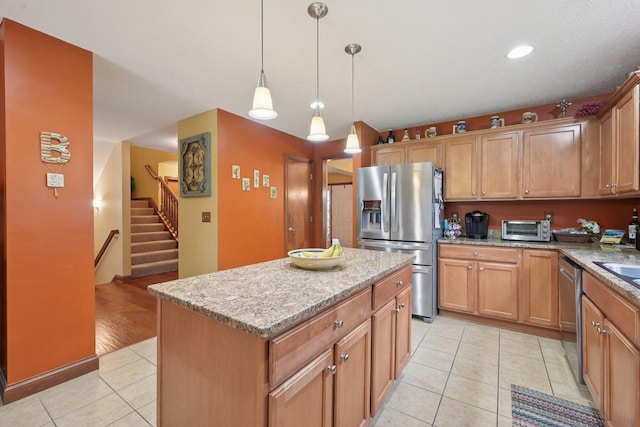 13946 Bainwick Dr NW, Pickerington, OH 43147 - kitchen with stainless steel appliances, light tile patterned floors, a center island, light stone countertops, and recessed lighting
