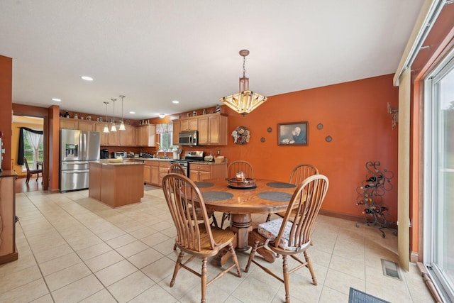 13946 Bainwick Dr NW, Pickerington, OH 43147 - dining space featuring light tile patterned flooring, plenty of natural light, and recessed lighting