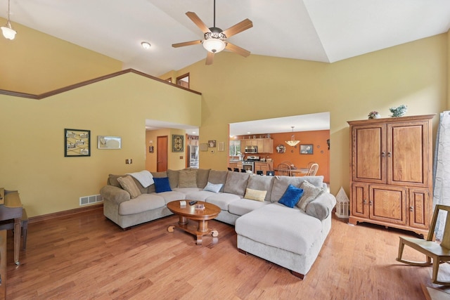 13946 Bainwick Dr NW, Pickerington, OH 43147 - living room featuring light wood-type flooring, ceiling fan, and high vaulted ceiling