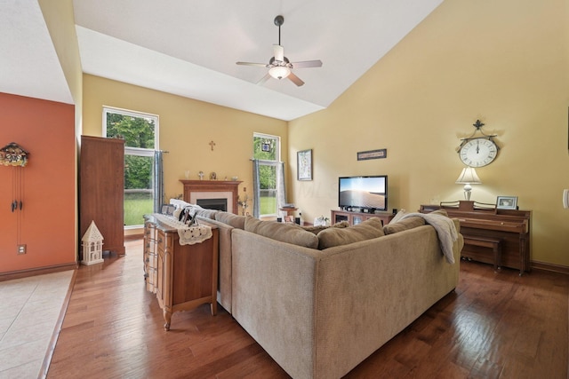 13946 Bainwick Dr NW, Pickerington, OH 43147 - living room featuring wood finished floors, a ceiling fan, high vaulted ceiling, and a fireplace