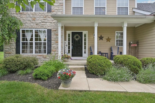 13946 Bainwick Dr NW, Pickerington, OH 43147 - property entrance with stone siding and covered porch