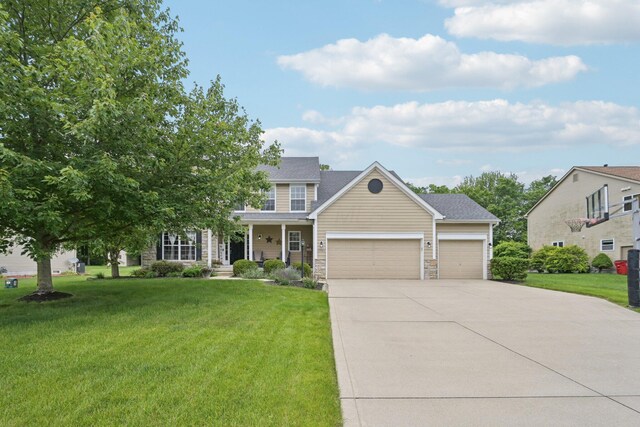 13946 Bainwick Dr NW, Pickerington, OH 43147 - view of front of property with a garage, driveway, a front lawn, and covered porch