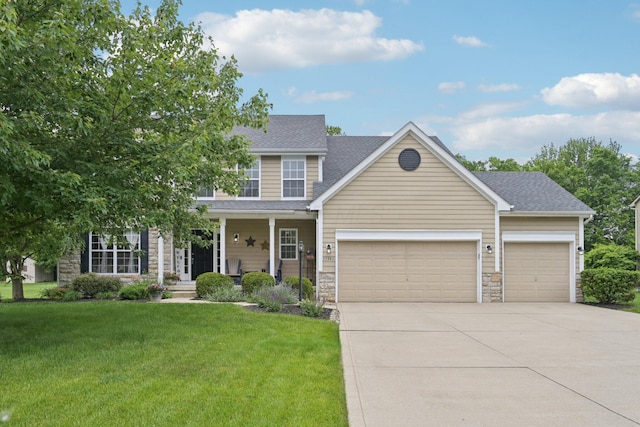 13946 Bainwick Dr NW, Pickerington, OH 43147 - view of front of property featuring stone siding, an attached garage, driveway, a front yard, and covered porch