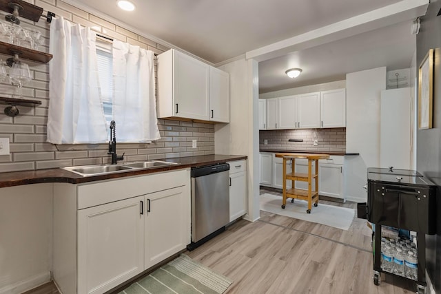 3029 Mcguffey Rd, Columbus, OH 43224 - kitchen featuring dishwasher, dark countertops, and decorative backsplash