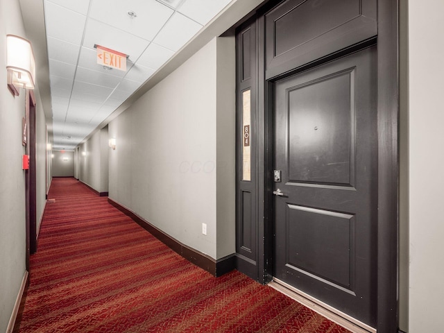 51 N High St Unit 804, Columbus, OH 43215 - hallway with dark carpet and baseboards