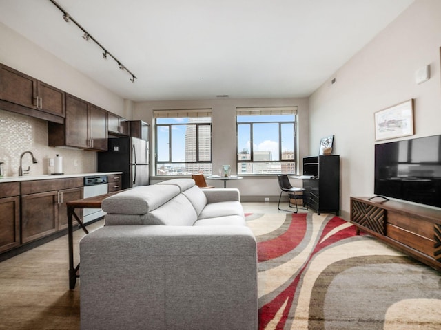 51 N High St Unit 804, Columbus, OH 43215 - living room featuring rail lighting and light wood-style floors