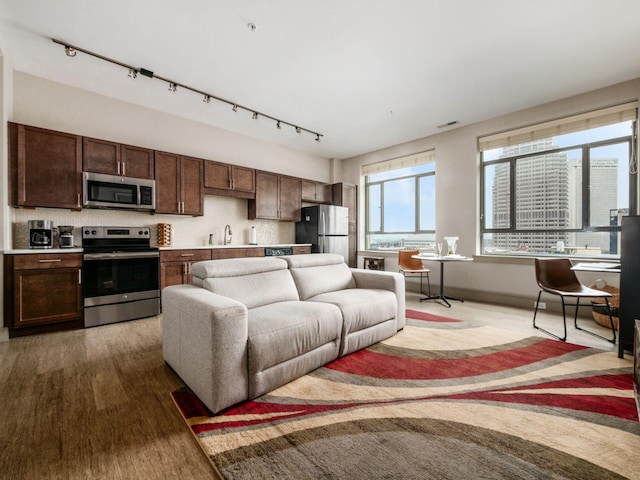 51 N High St Unit 804, Columbus, OH 43215 - living area featuring rail lighting and wood finished floors