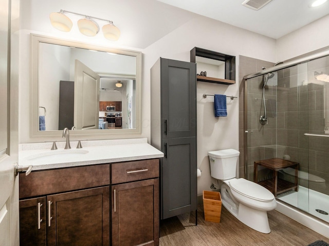 51 N High St Unit 804, Columbus, OH 43215 - bathroom with a stall shower, vanity, and wood finished floors