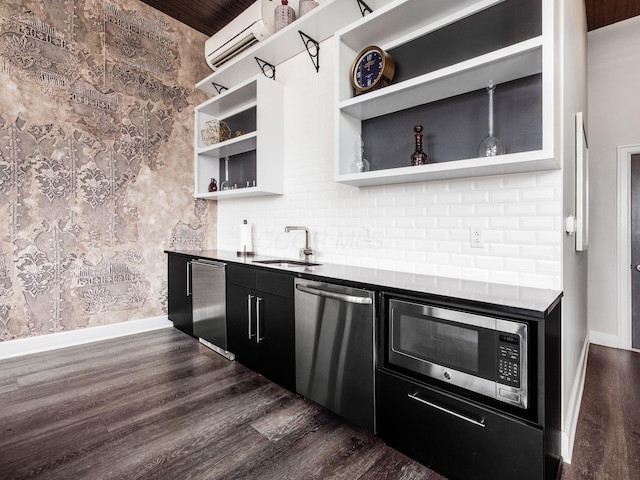 51 N High St Unit 804, Columbus, OH 43215 - kitchen featuring appliances with stainless steel finishes, open shelves, dark cabinets, dark wood-style flooring, and a wall unit AC
