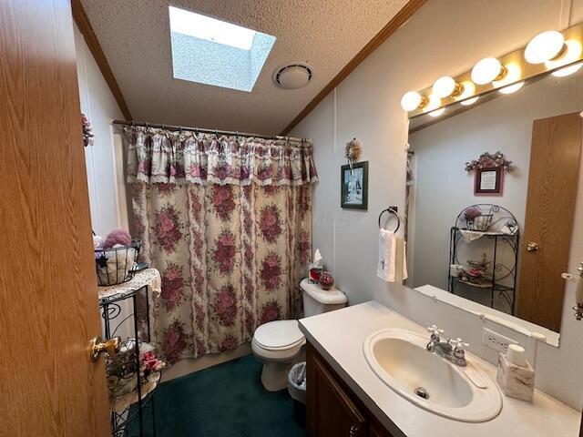 10830 Voris Rd, Logan, OH 43138 - bathroom featuring crown molding, a skylight, a textured ceiling, vanity, and a shower with curtain