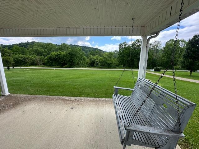 10830 Voris Rd, Logan, OH 43138 - view of patio featuring a wooded view