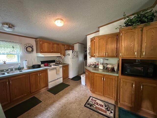 10830 Voris Rd, Logan, OH 43138 - kitchen featuring white appliances, under cabinet range hood, a textured ceiling, light countertops, and brown cabinets