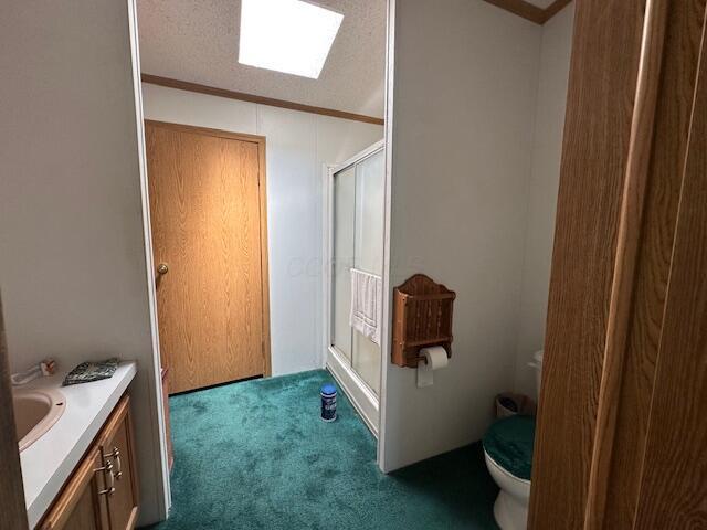 10830 Voris Rd, Logan, OH 43138 - full bathroom featuring a shower stall, vanity, and crown molding