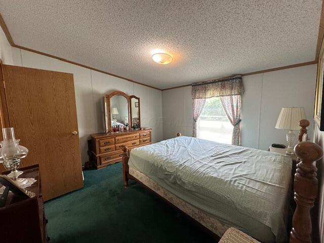 10830 Voris Rd, Logan, OH 43138 - bedroom with crown molding, carpet floors, and a textured ceiling