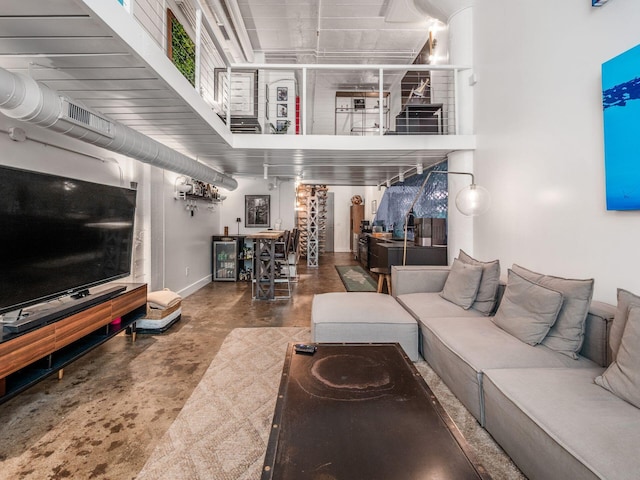 60 E Spring St Unit 214, Columbus, OH 43215 - living room featuring concrete floors and baseboards