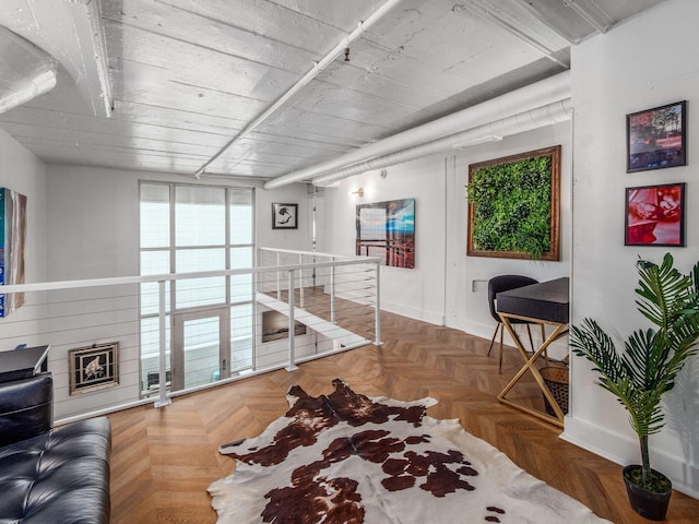 60 E Spring St Unit 214, Columbus, OH 43215 - hallway featuring an upstairs landing and baseboards