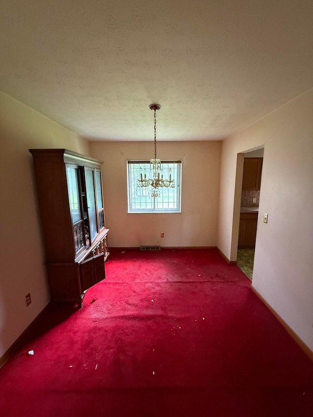 3391 Compton Dr, Columbus, OH 43219 - unfurnished dining area with a chandelier and carpet
