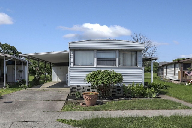 4455 Janice Marie Blvd, Obetz, OH 43207 - manufactured / mobile home with concrete driveway and an attached carport