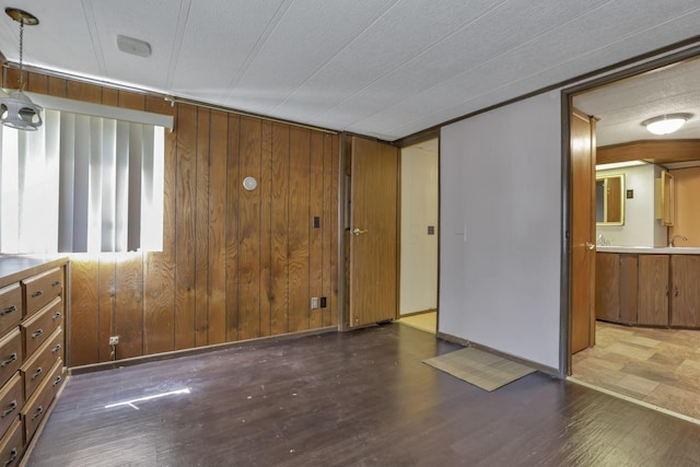 4455 Janice Marie Blvd, Obetz, OH 43207 - unfurnished bedroom with wooden walls, wood finished floors, and ensuite bathroom