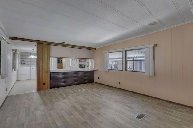 4455 Janice Marie Blvd, Obetz, OH 43207 - unfurnished living room featuring washer and clothes dryer and wood finished floors