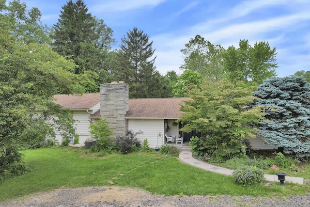 285 E Broad St, Pataskala, OH 43062 - view of front of home featuring a front lawn and a chimney