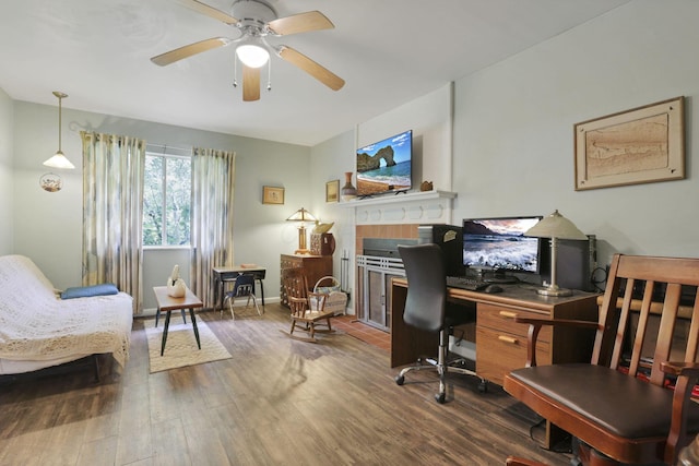 285 E Broad St, Pataskala, OH 43062 - home office with wood finished floors, a ceiling fan, and a tile fireplace