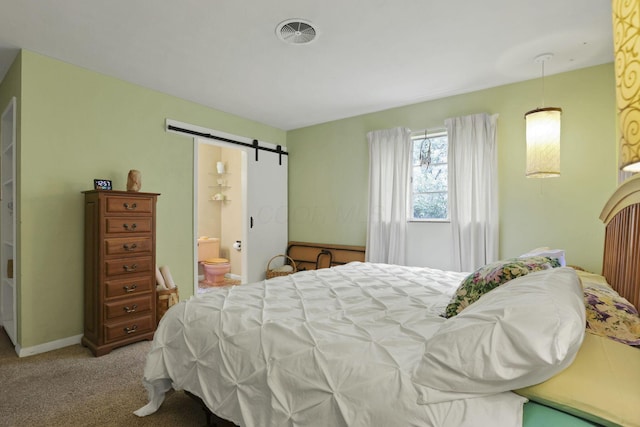 285 E Broad St, Pataskala, OH 43062 - bedroom with a barn door, light carpet, and ensuite bathroom
