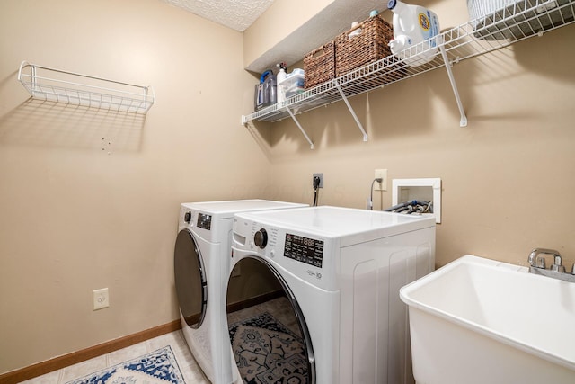 9188 Colonial Commons Dr, Columbus, OH 43240 - laundry room featuring washing machine and dryer and light tile patterned floors