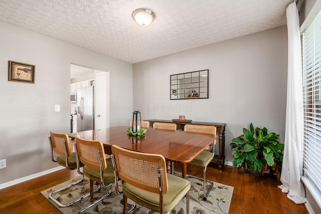 9188 Colonial Commons Dr, Columbus, OH 43240 - dining area with wood finished floors and a textured ceiling