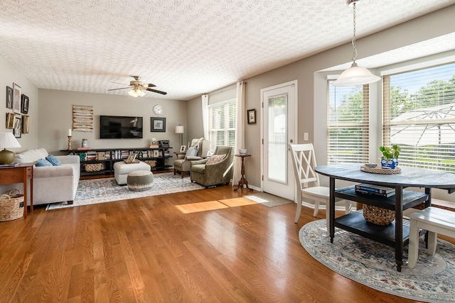 9188 Colonial Commons Dr, Columbus, OH 43240 - living room featuring a ceiling fan, wood finished floors, and healthy amount of natural light