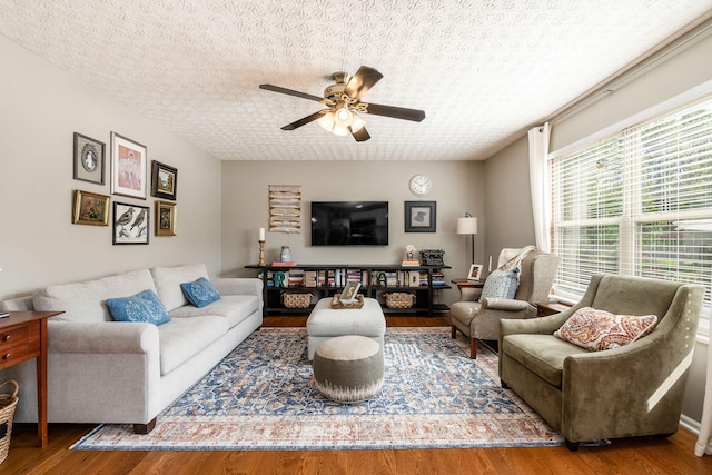 9188 Colonial Commons Dr, Columbus, OH 43240 - living room with ceiling fan, wood finished floors, and a textured ceiling
