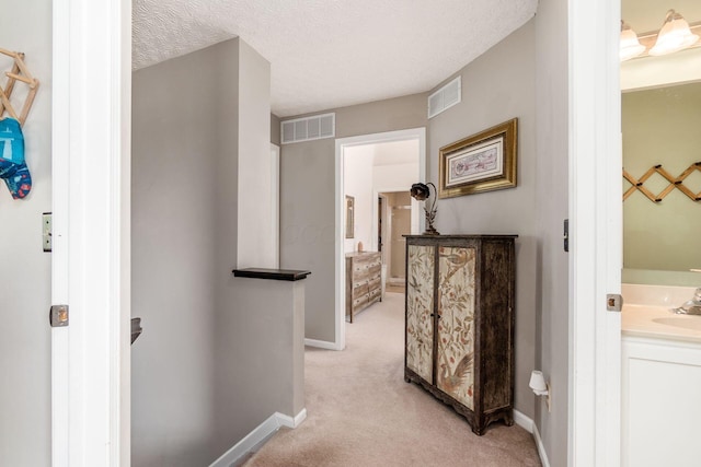 9188 Colonial Commons Dr, Columbus, OH 43240 - hall featuring light colored carpet and a textured ceiling