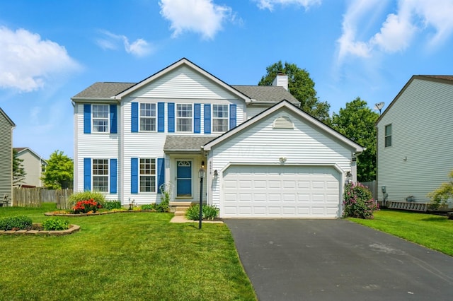 8578 Bivouac Pl, Galloway, OH 43119 - view of front of property with asphalt driveway, an attached garage, and a chimney