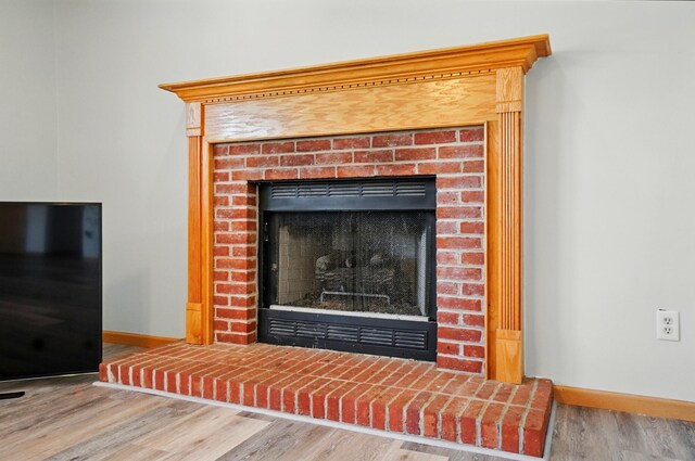 8578 Bivouac Pl, Galloway, OH 43119 - detailed view of wood finished floors and a fireplace