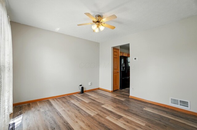 8578 Bivouac Pl, Galloway, OH 43119 - spare room with wood finished floors and ceiling fan