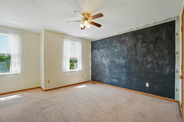 8578 Bivouac Pl, Galloway, OH 43119 - unfurnished room with carpet floors, ceiling fan, and a textured ceiling