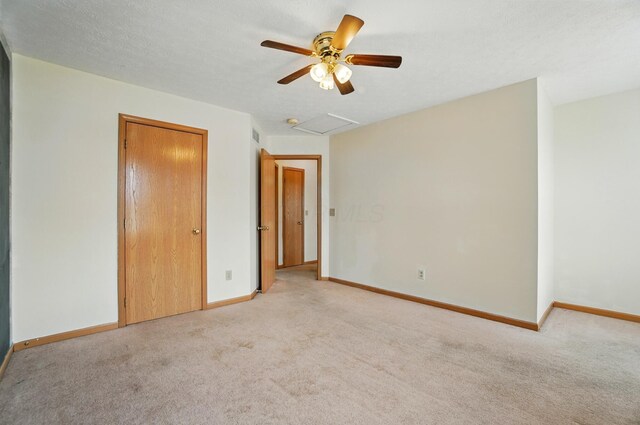 8578 Bivouac Pl, Galloway, OH 43119 - unfurnished bedroom with attic access, light colored carpet, ceiling fan, and a closet