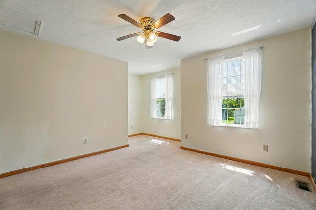 8578 Bivouac Pl, Galloway, OH 43119 - carpeted spare room featuring ceiling fan, a textured ceiling, and attic access