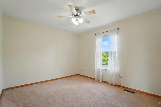 8578 Bivouac Pl, Galloway, OH 43119 - unfurnished room with light colored carpet and ceiling fan
