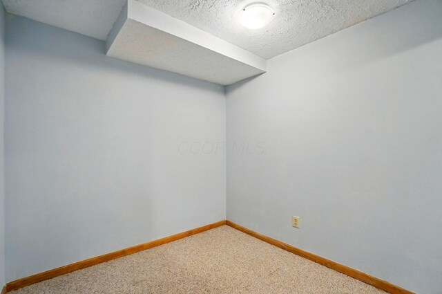 8578 Bivouac Pl, Galloway, OH 43119 - unfurnished room featuring carpet and a textured ceiling