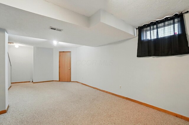 8578 Bivouac Pl, Galloway, OH 43119 - basement featuring carpet and a textured ceiling