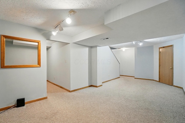8578 Bivouac Pl, Galloway, OH 43119 - finished below grade area with carpet flooring, rail lighting, and a textured ceiling