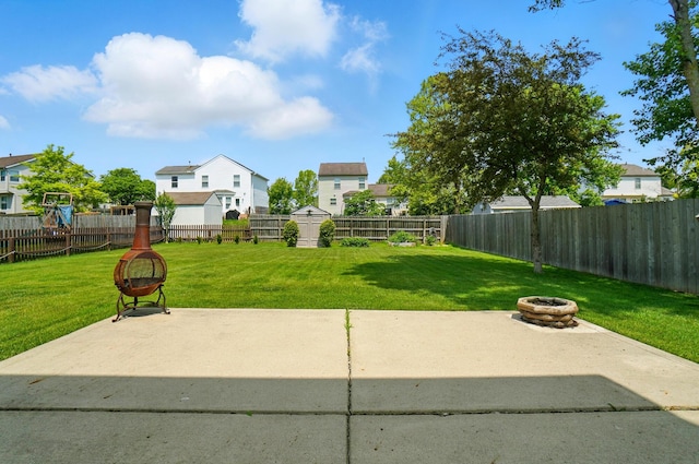 8578 Bivouac Pl, Galloway, OH 43119 - fenced backyard featuring a fire pit and a patio area