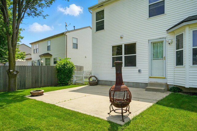 8578 Bivouac Pl, Galloway, OH 43119 - rear view of property featuring a fire pit, entry steps, and a patio