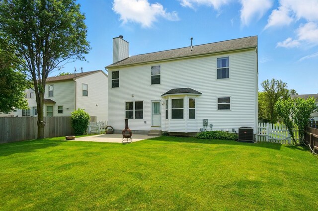 8578 Bivouac Pl, Galloway, OH 43119 - back of property featuring a patio, a fenced backyard, entry steps, and a chimney