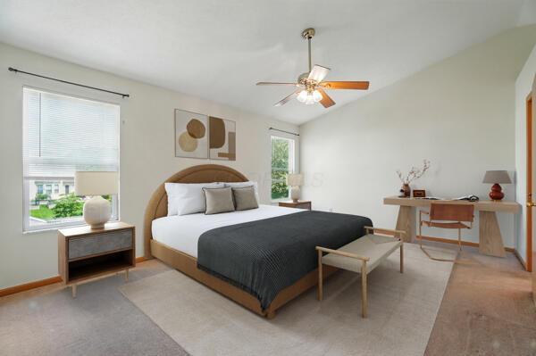 8578 Bivouac Pl, Galloway, OH 43119 - bedroom with light colored carpet, lofted ceiling, and a ceiling fan