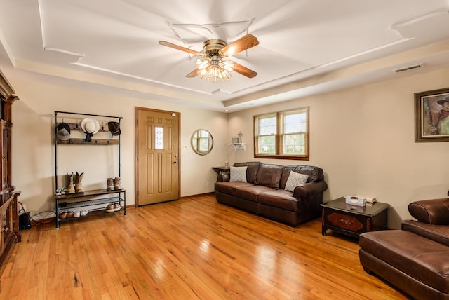 4005 Curtis Ave, Grove City, OH 43123 - living area with a raised ceiling, light wood-style floors, and ceiling fan